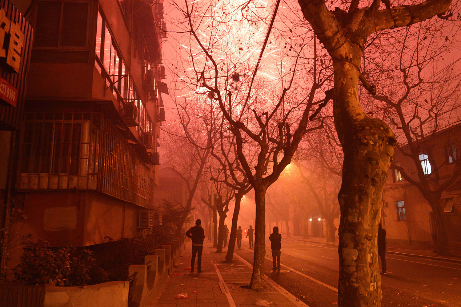Fireworks explode in a street of Shanghai on the eve of Chinese New Year on Jan. 30, 2014.