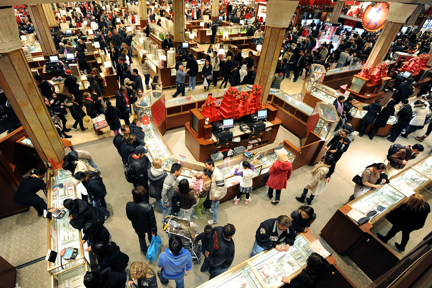 People crowd the aisles inside Macy's department store on Nov. 25, 2011 in New York after the midnight opening to begin the "Black Friday" shopping weekend. (Stan Honda—AFP/Getty Images)