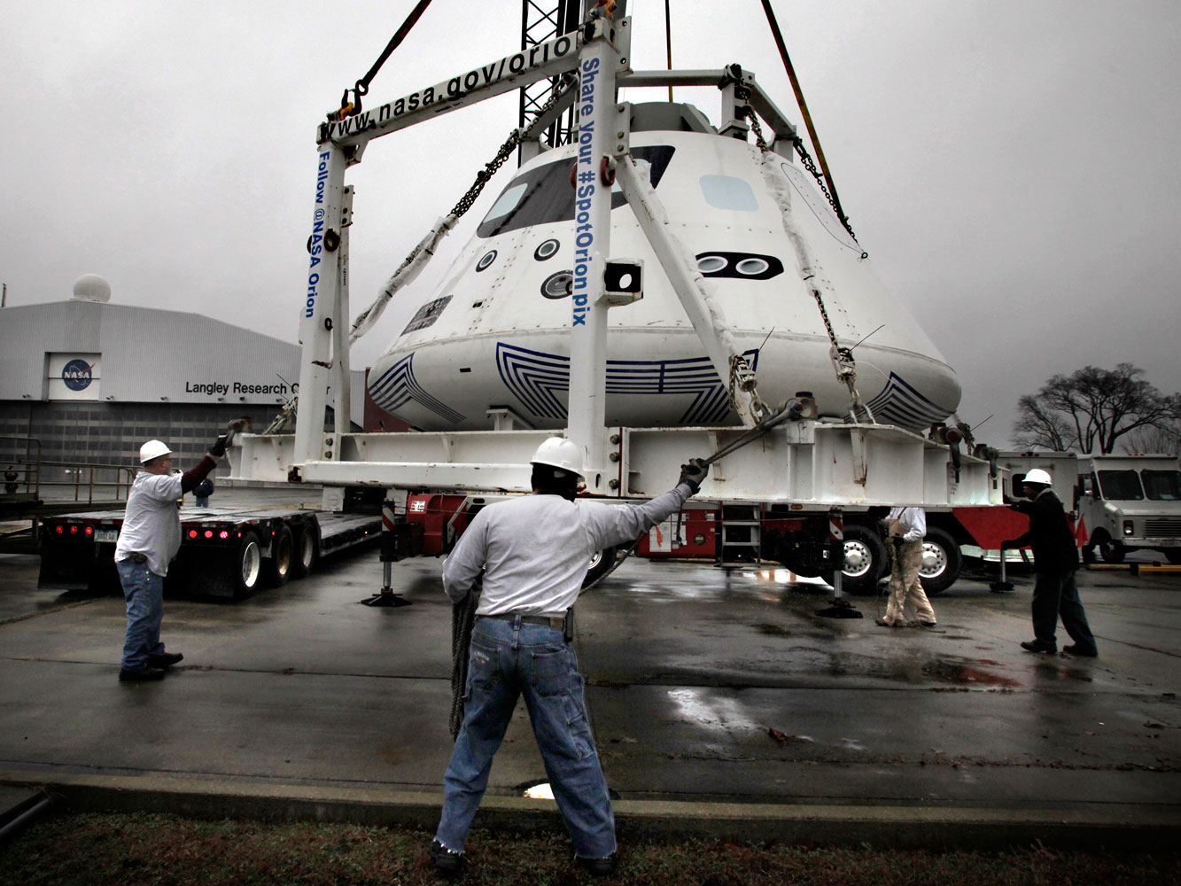 This Orion boilerplate—essentially a dead weight mock-up—is loaded on a flatbed trailer for shipment to San Diego, where it is used to rehearse water recovery in the run-up to the 2014 test launch.