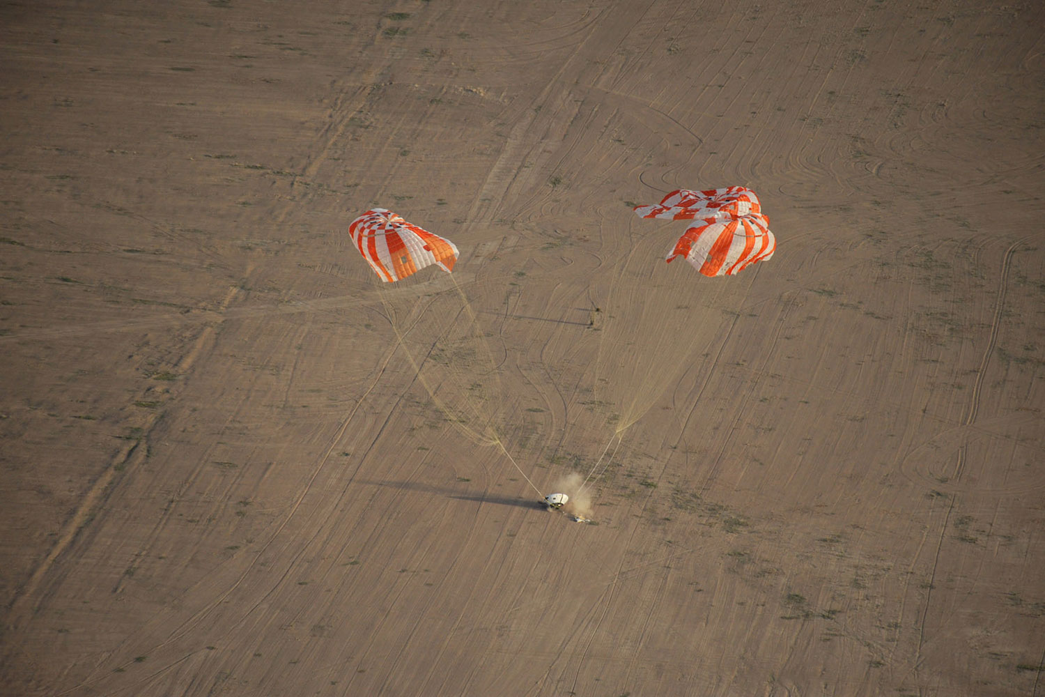 A test model of the Orion spacecraft with its parachutes was dropped high above the the Arizona desert on Feb. 29, 2012. This particular drop test—the latest of a series—studied the stability of the wake left by the Orion as it descended.