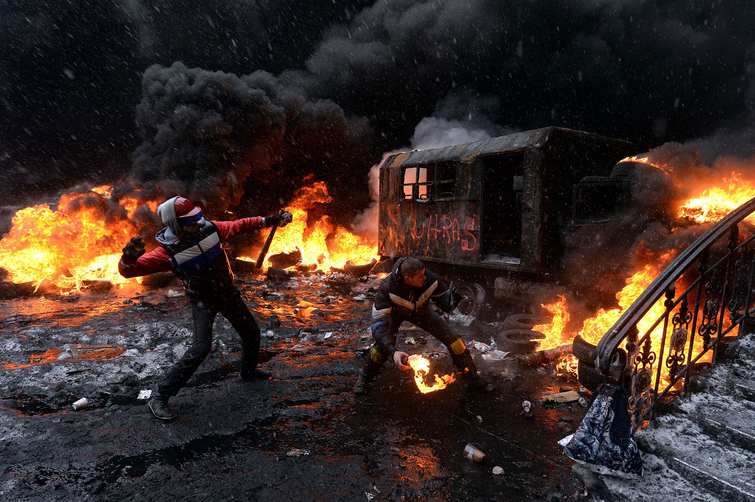 A protestor throws a molotov cocktail at riot police in the centre of Kiev on Jan. 22, 2014.