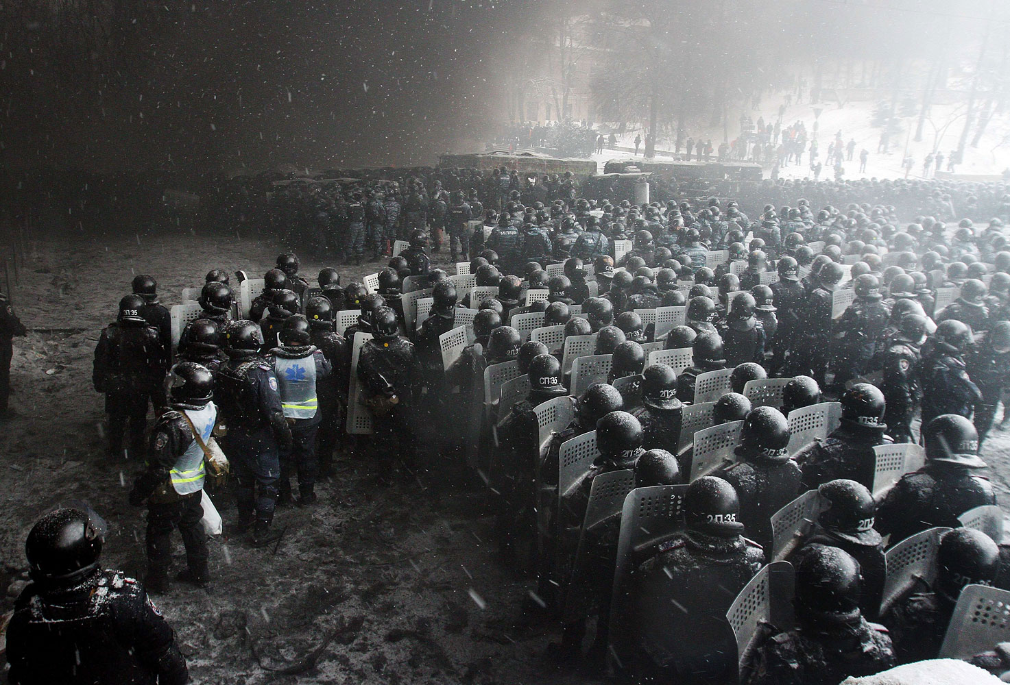 Riot police officers gather as they clash with protestors in the center of Kiev on Jan. 22, 2014.
