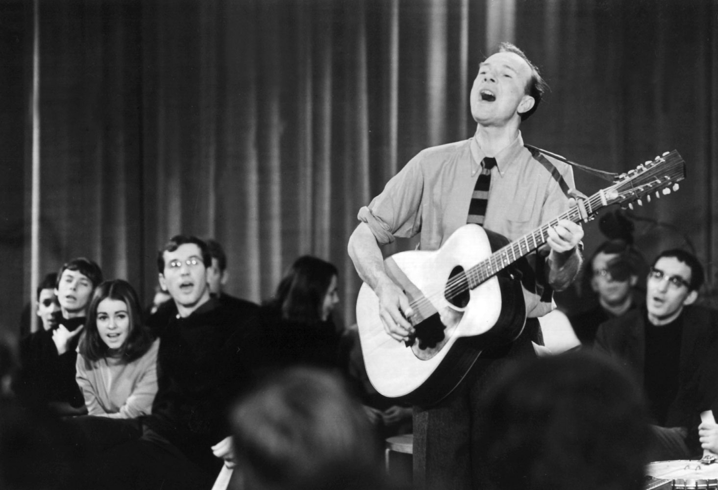 Pete Seeger performs on a TV show in East Berlin, on Jan. 3, 1967.