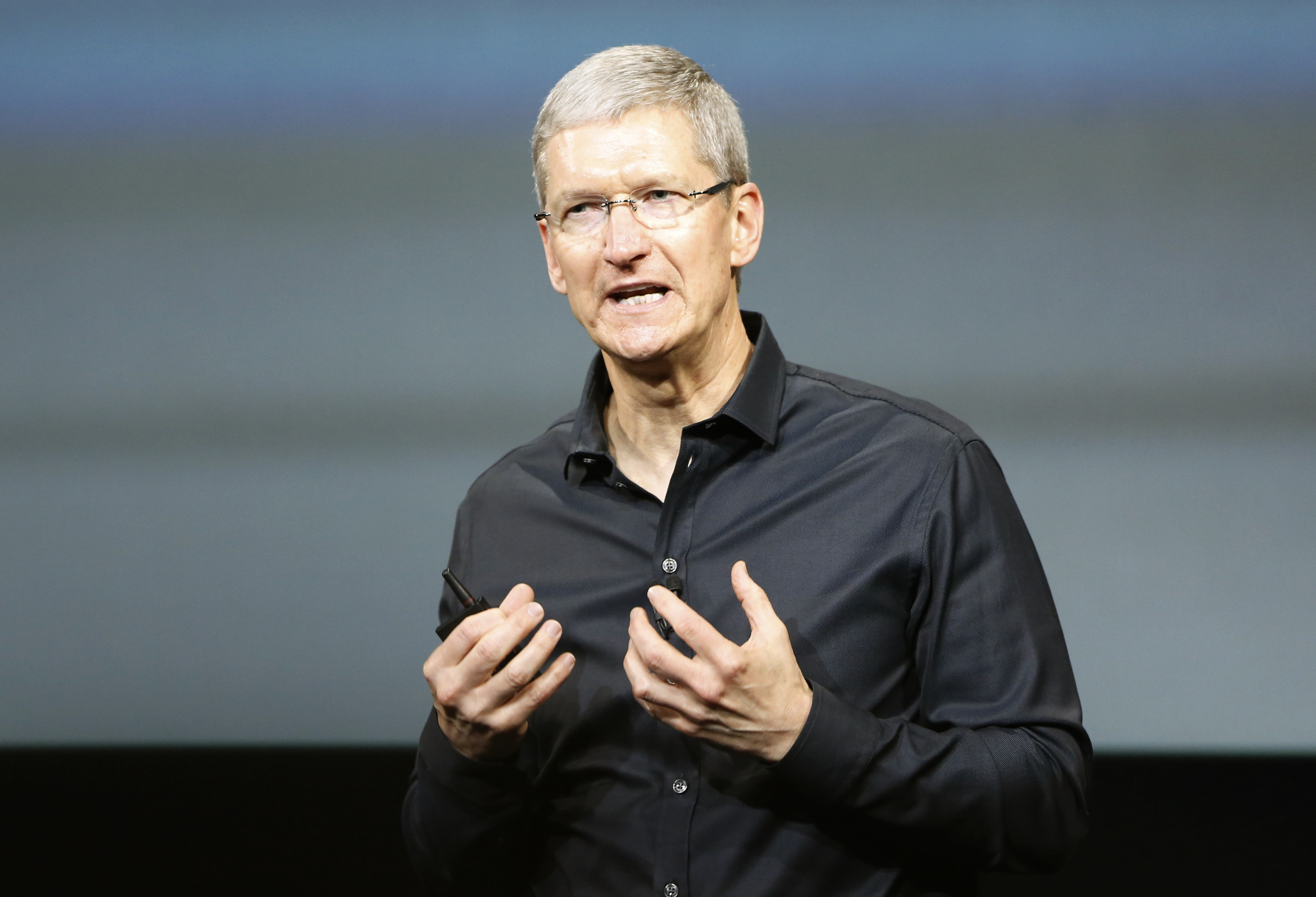 Apple Inc CEO Tim Cook speaks from the stage during Apple Inc's media event in Cupertino