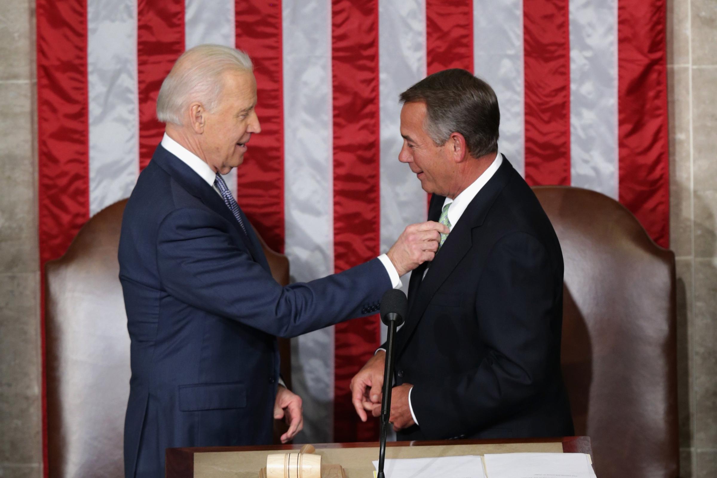 Vice President Joe Biden fixes House Speaker John Boehner's tie.