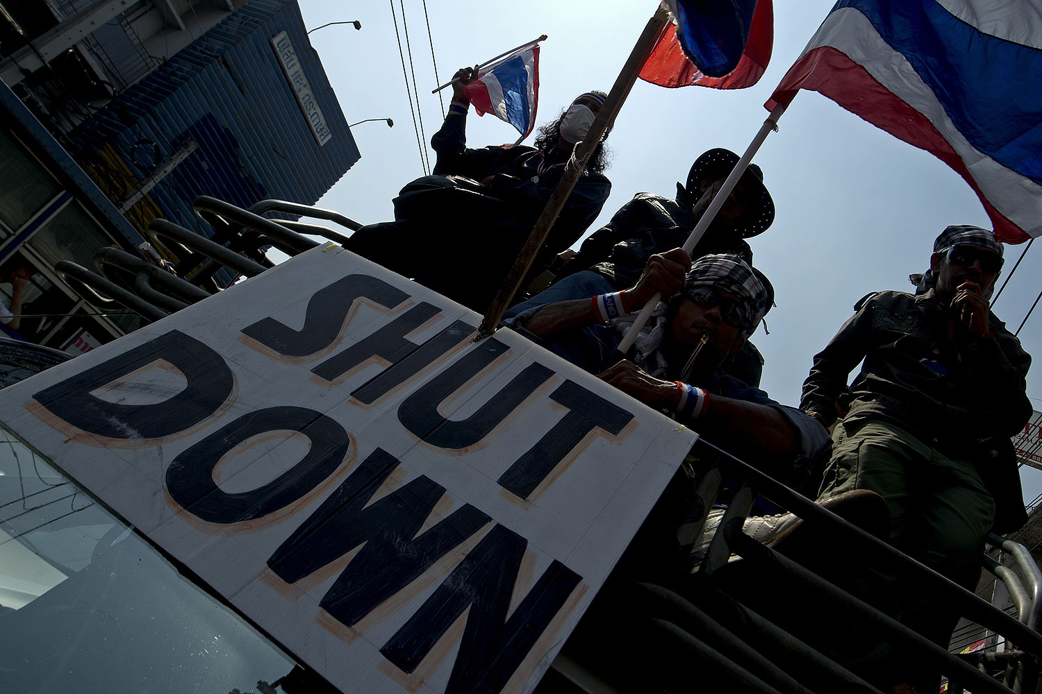 Thai anti-government protesters wave national flags as they parade during a rally in Bangkok on Jan. 24, 2014 (Pornchai Kittiwongsakul / AFP / Getty Images)