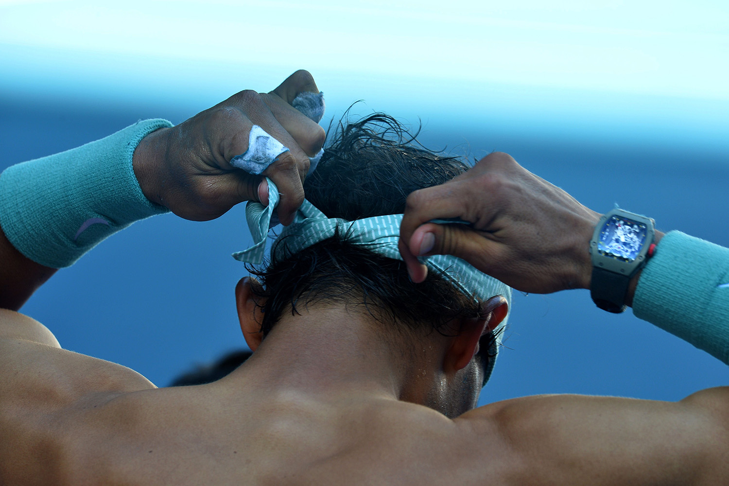 Jan. 22, 2014. Spain's Rafael Nadal ties his headband during his men's singles match against Bulgaria's Grigor Dimitrov on day ten of the 2014 Australian Open tennis tournament in Melbourne.
