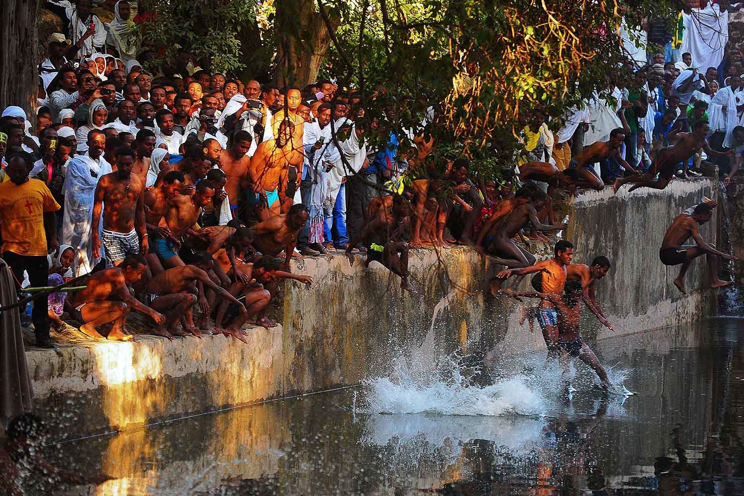 Jan. 19, 2014. Ethiopian Orthodox pilgrims jump into the Fasilides baths during the Timkat festival in Gondar.