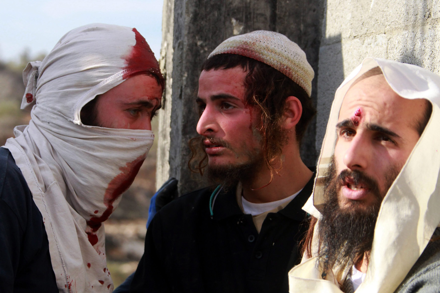 Palestinian villagers detained and beat up a group of Israeli settlers
