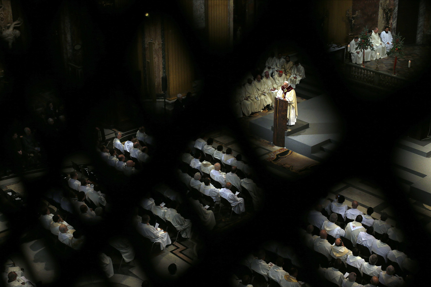 Pope Francis conducts a mass at the Church of the Most Holy Name of Jesus in downtown Rome