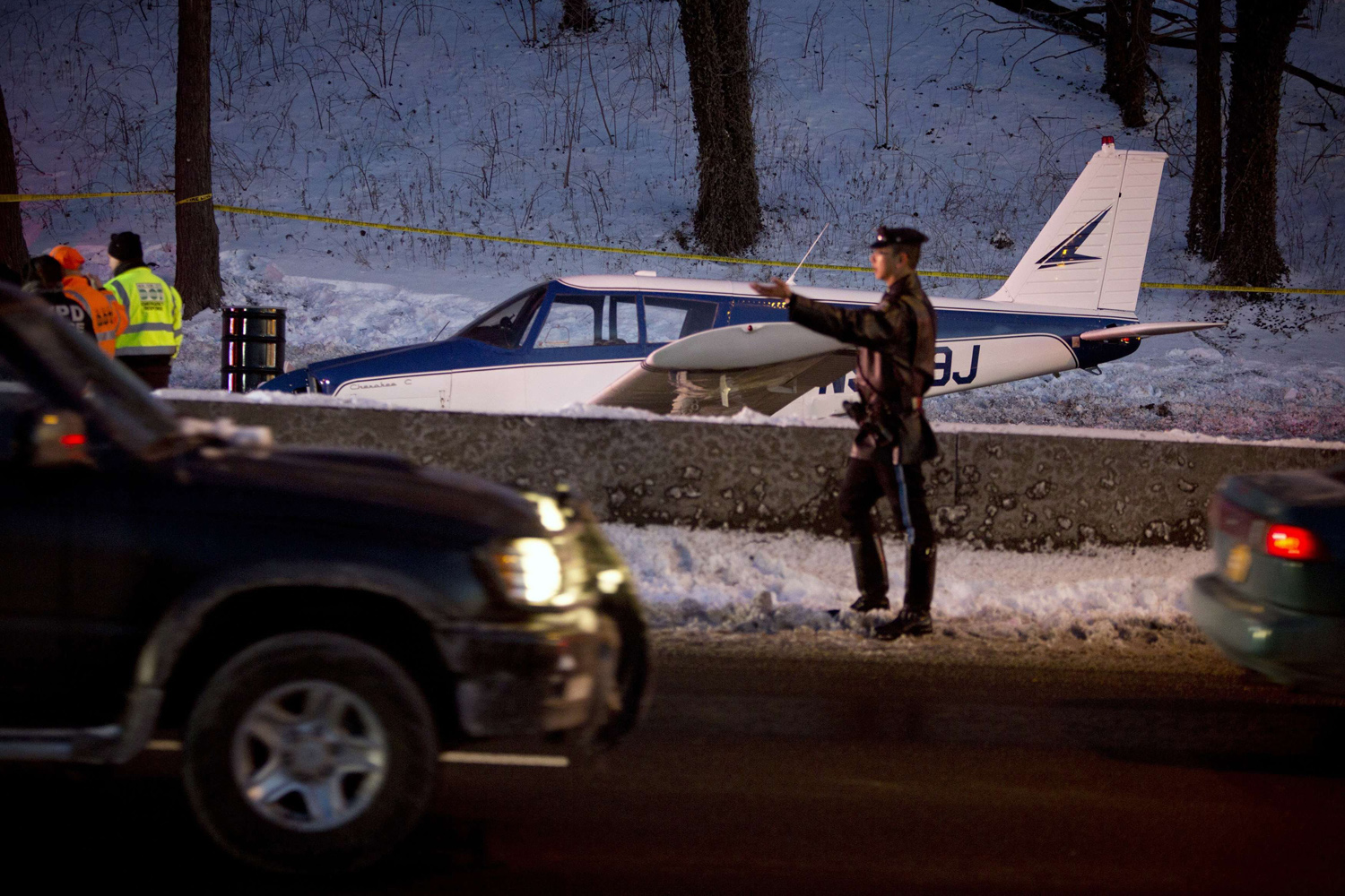 Single engine plane is seen amid vehicle traffic on the Major Deegan Expressway in the Bronx borough of New York