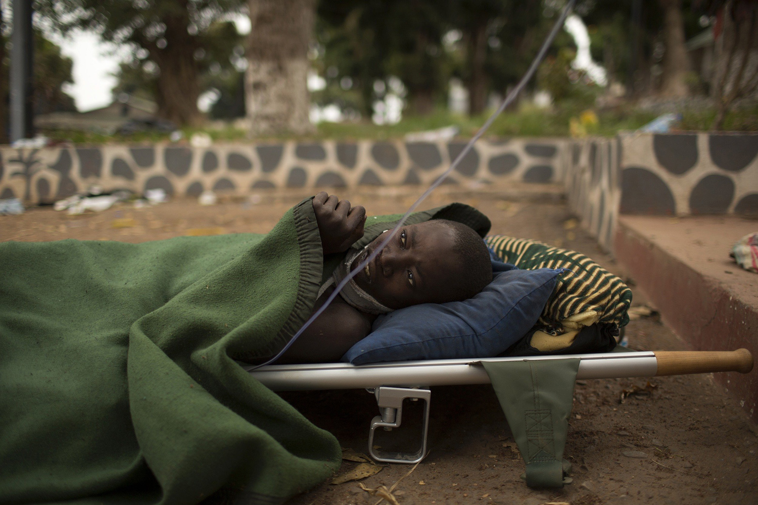 Wangouma Nestor, lies on a stretcher in Camp de Roux, a main base recently abandoned by former Seleka fighters near Bangui