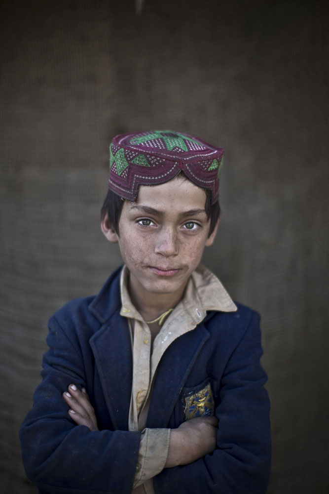 Ibraheem Rahees, 8, poses for a picture in a slum on the outskirts of Islamabad, Pakistan on Jan. 26, 2014.