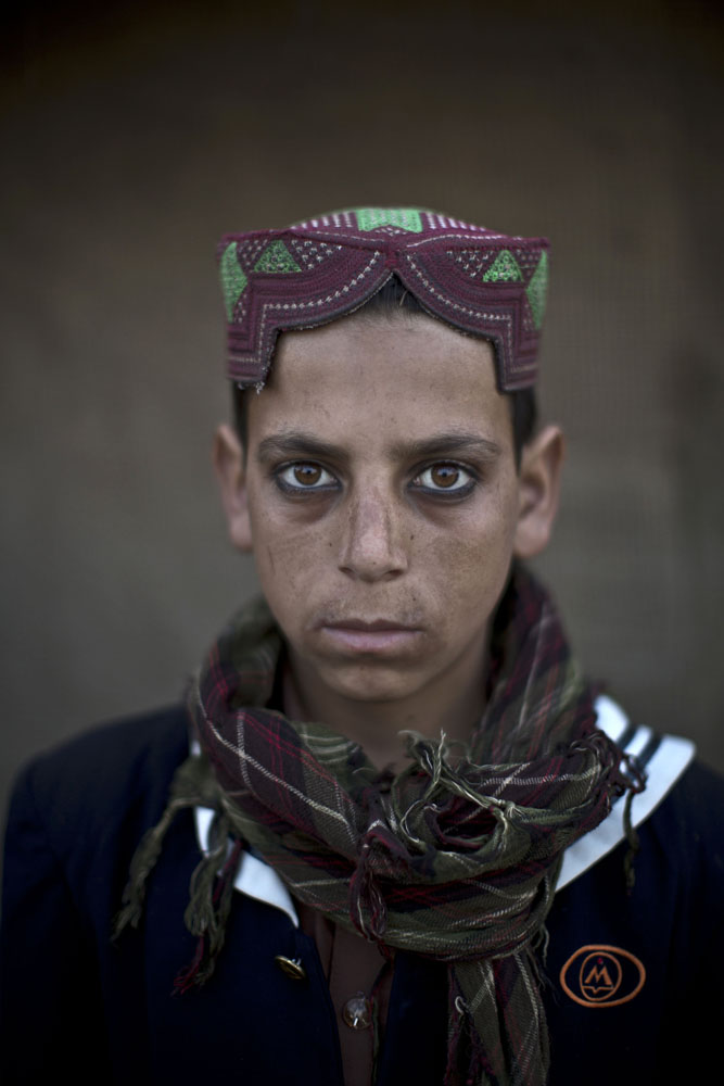Akhtar Babrek, 13, poses for a picture in a slum on the outskirts of Islamabad, Pakistan on Jan. 24, 2014.