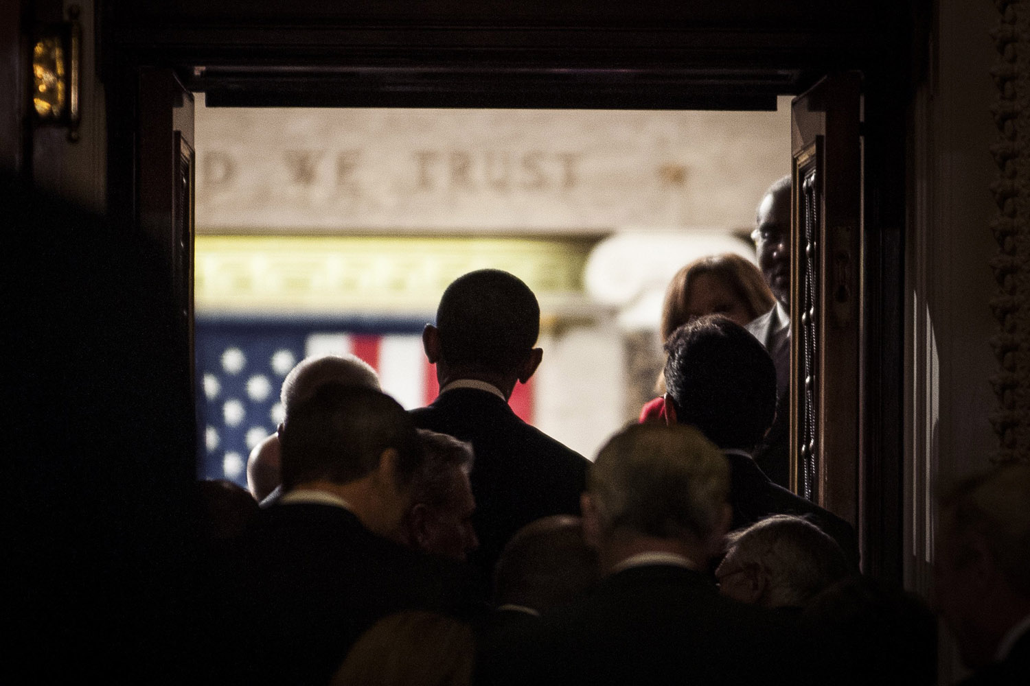 President Barack Obama enters the House Chamber of the Capitol Building to deliver the State of the Union address.
