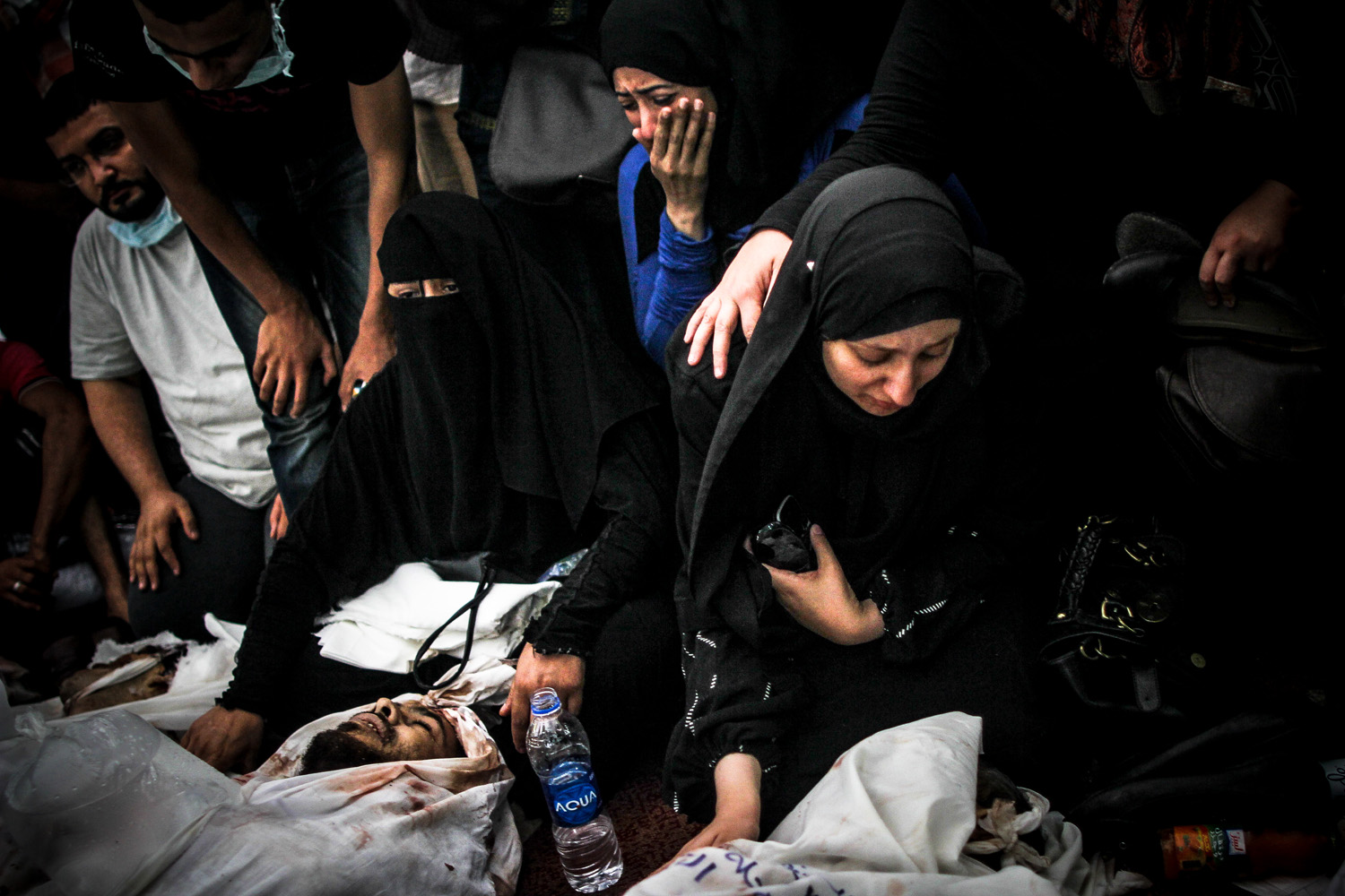 Aug. 15, 2013. Women mourn over bodies of  relatives in Iman mosque near Rabaa, a day after security forces violently dispersed the camp and killed over 800 protesters.