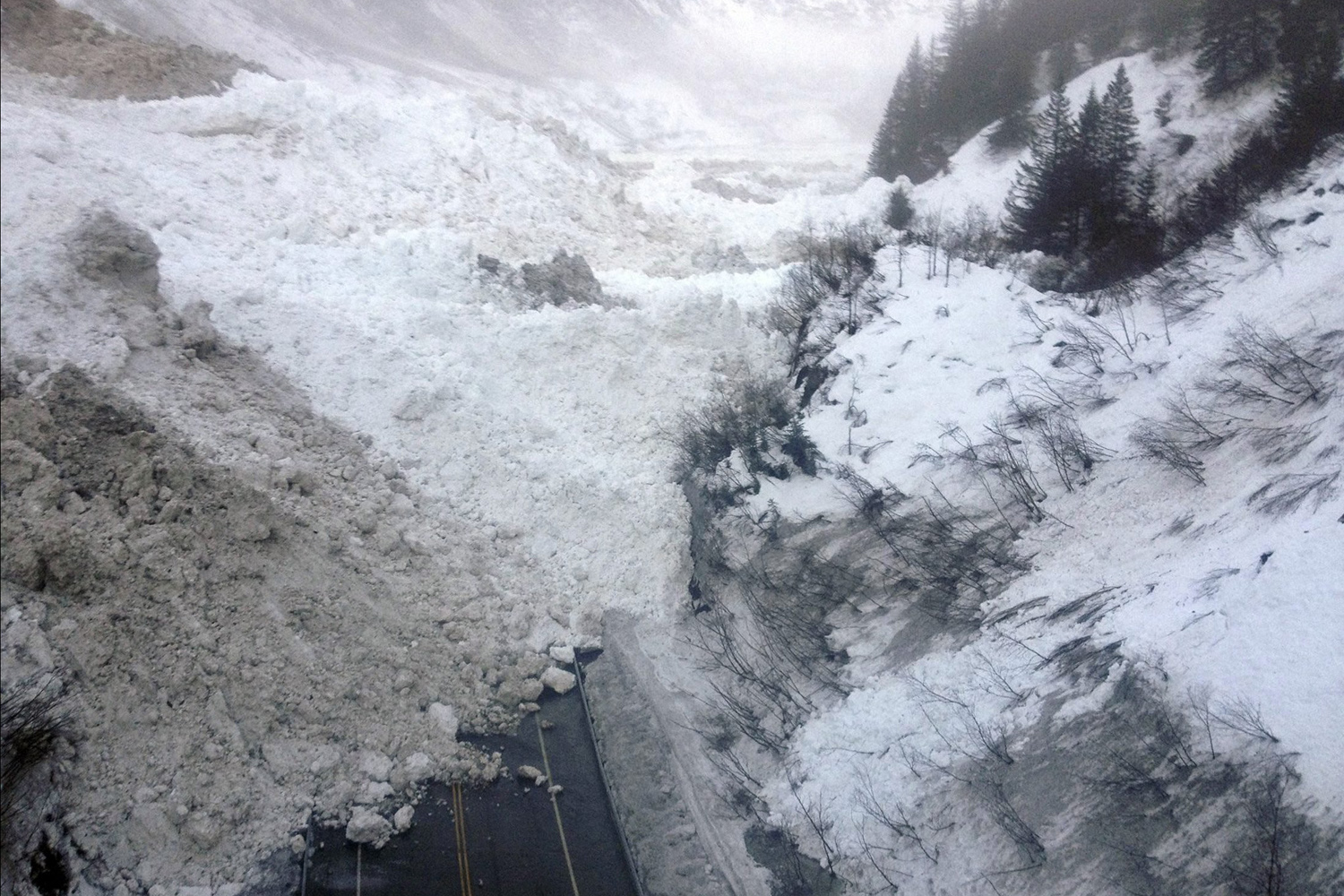 Avalanche debris is pictured on the Richardson Highway in Alaska in this handout photo