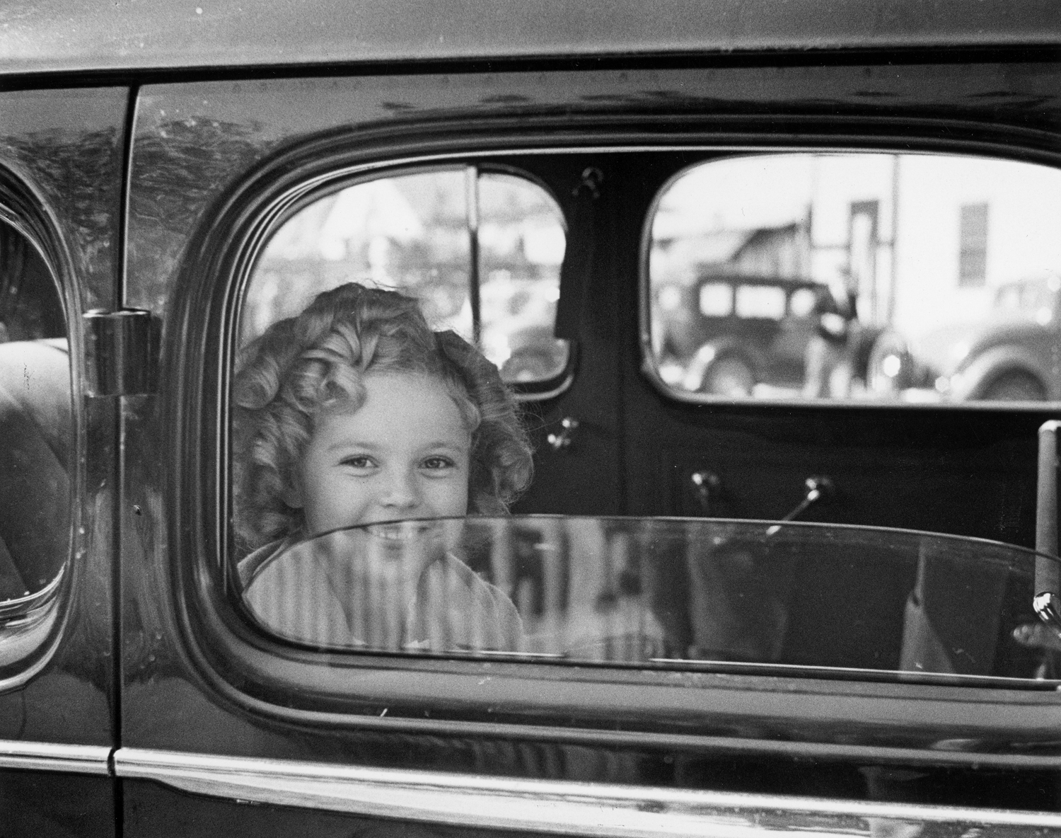 Shirley Temple arrives at the 20th Century Fox studio to celebrate her eighth birthday, 1936.