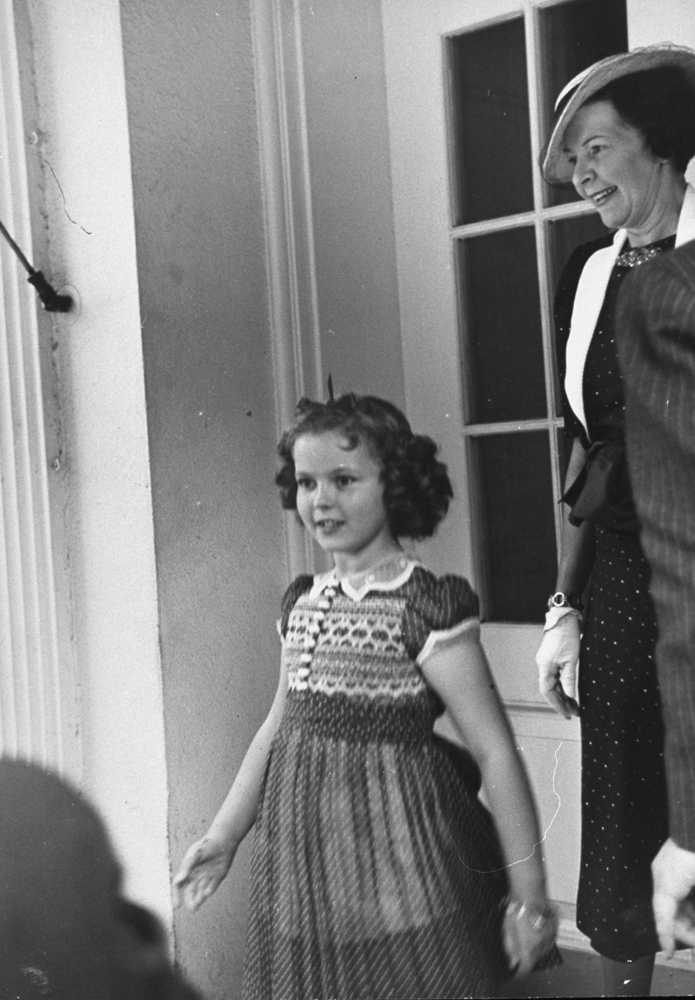Shirley Temple leaving the White House, 1938.