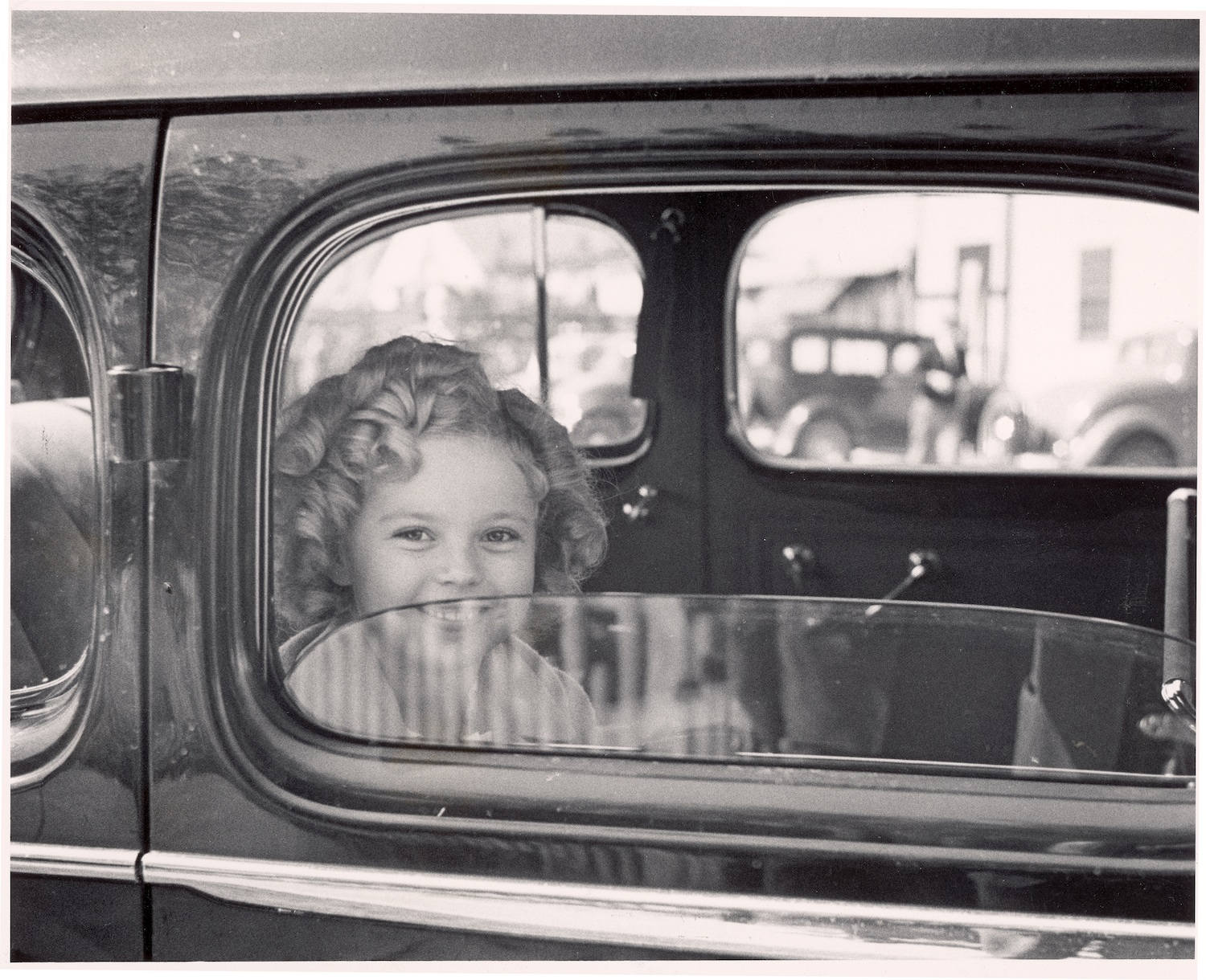 Child actress Shirley Temple arriving at 20th Century Fox film studio lot to celebrate her eighth birthday.