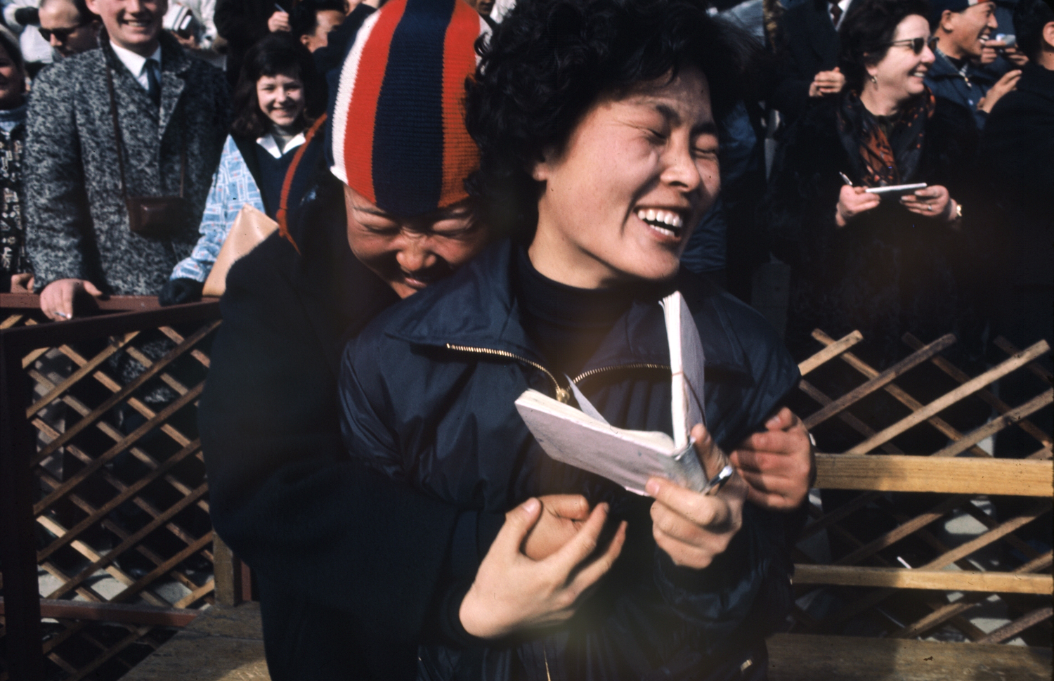 Happy fans and autograph-seekers at the 1964 Innsbruck Winter Olympics.