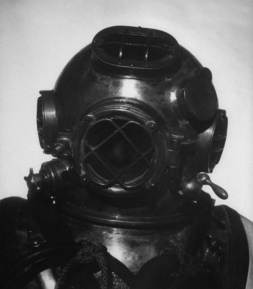 A diver wearing a metal helmet.