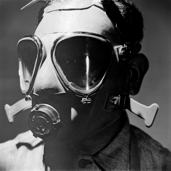 Man wearing a gas mask.