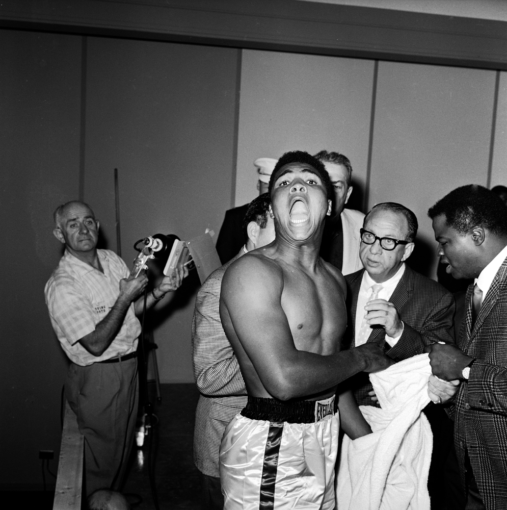 Cassius Clay weighs in before his 1964 heavyweight title bout with Sonny Liston.