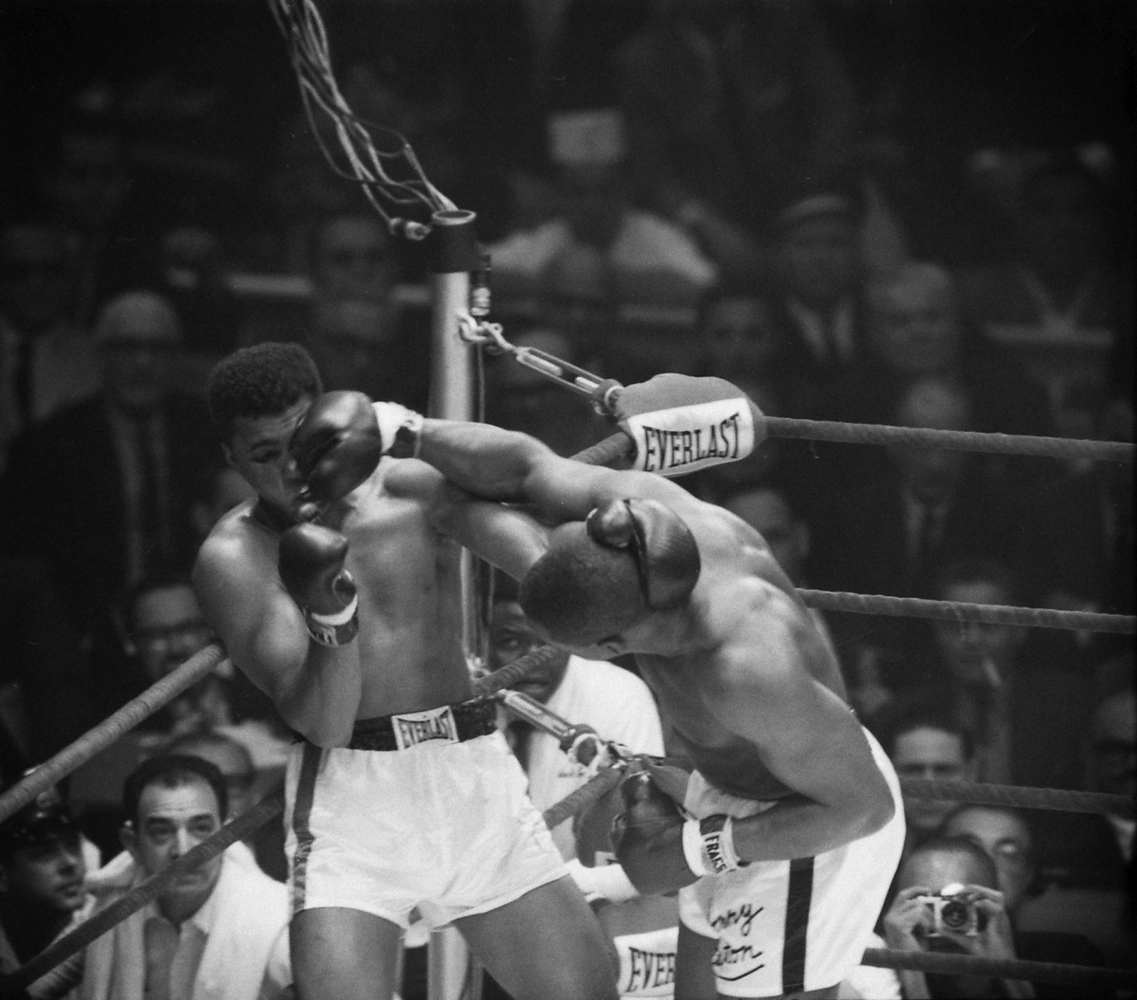Sonny Liston hammers Cassius Clay during their first heavyweight title fight, Feb. 1964.
