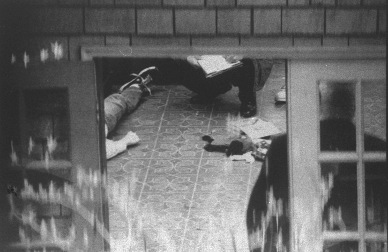 Investigators examine the body of Kurt Cobain in a room atop the garage of his Seattle home, April 8, 1994.