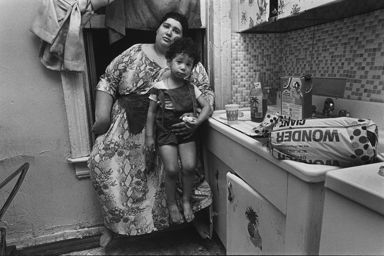 Jeanette's neighbors in their kitchen, Brooklyn, New York, 1979.