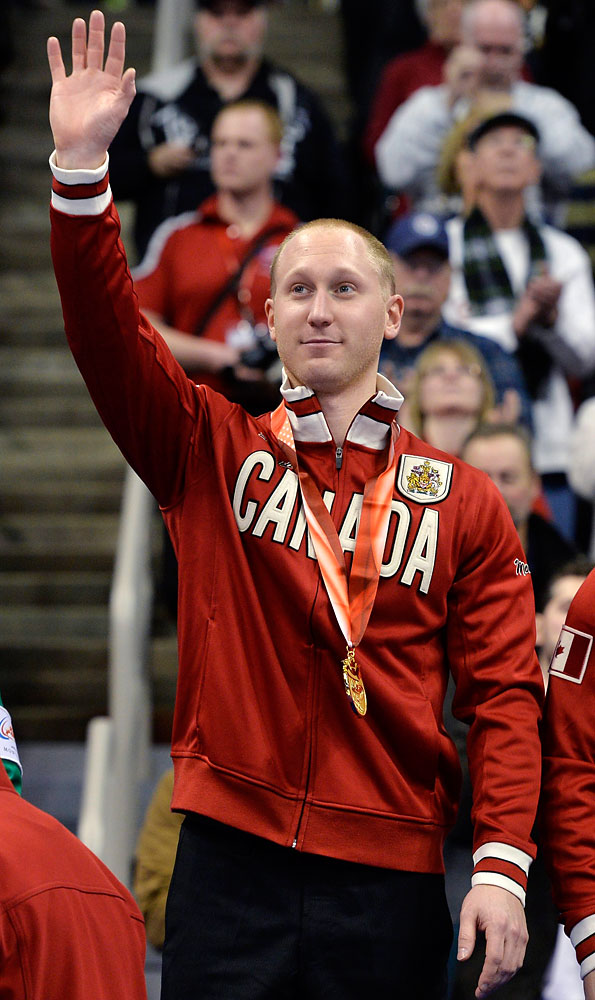 Skip Brad Jacobs waves to the crowd after his win over Team Morris during the men's final at the Roar of the Rings Canadian Olympic Curling Trials in Winnipeg, Dec. 8, 2013.