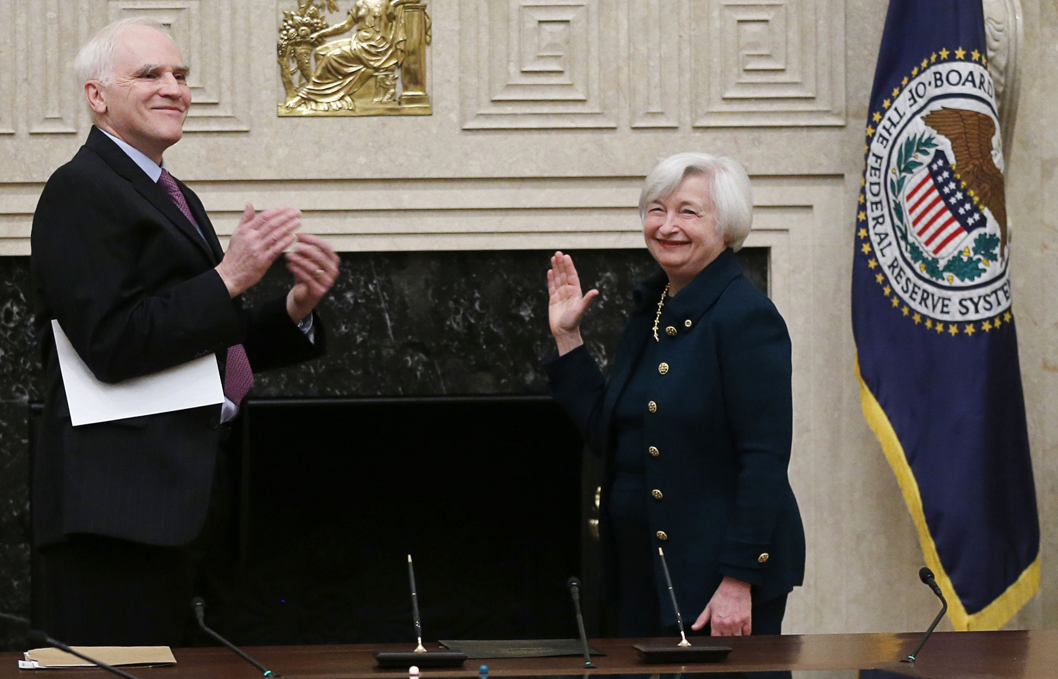 Federal Reserve Board Governor Tarullo applauds new Federal Reserve Board Chairwoman Yellen after administering the oath of office at the Federal Reserve Board in Washington