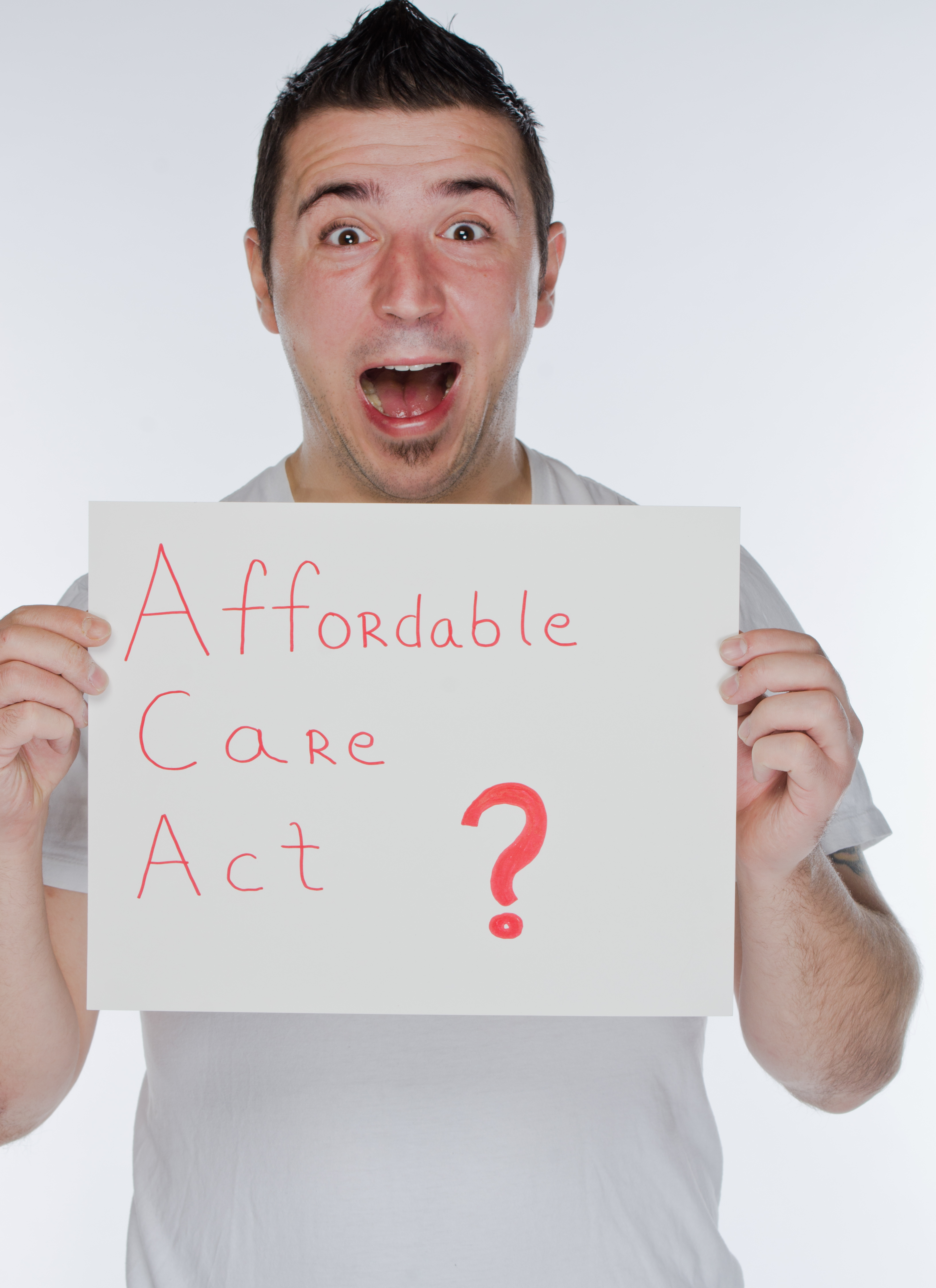 Shocked man holding 'Affordable Care Act' sign (Getty Images/Flickr Open / Getty Images/Flickr Open)