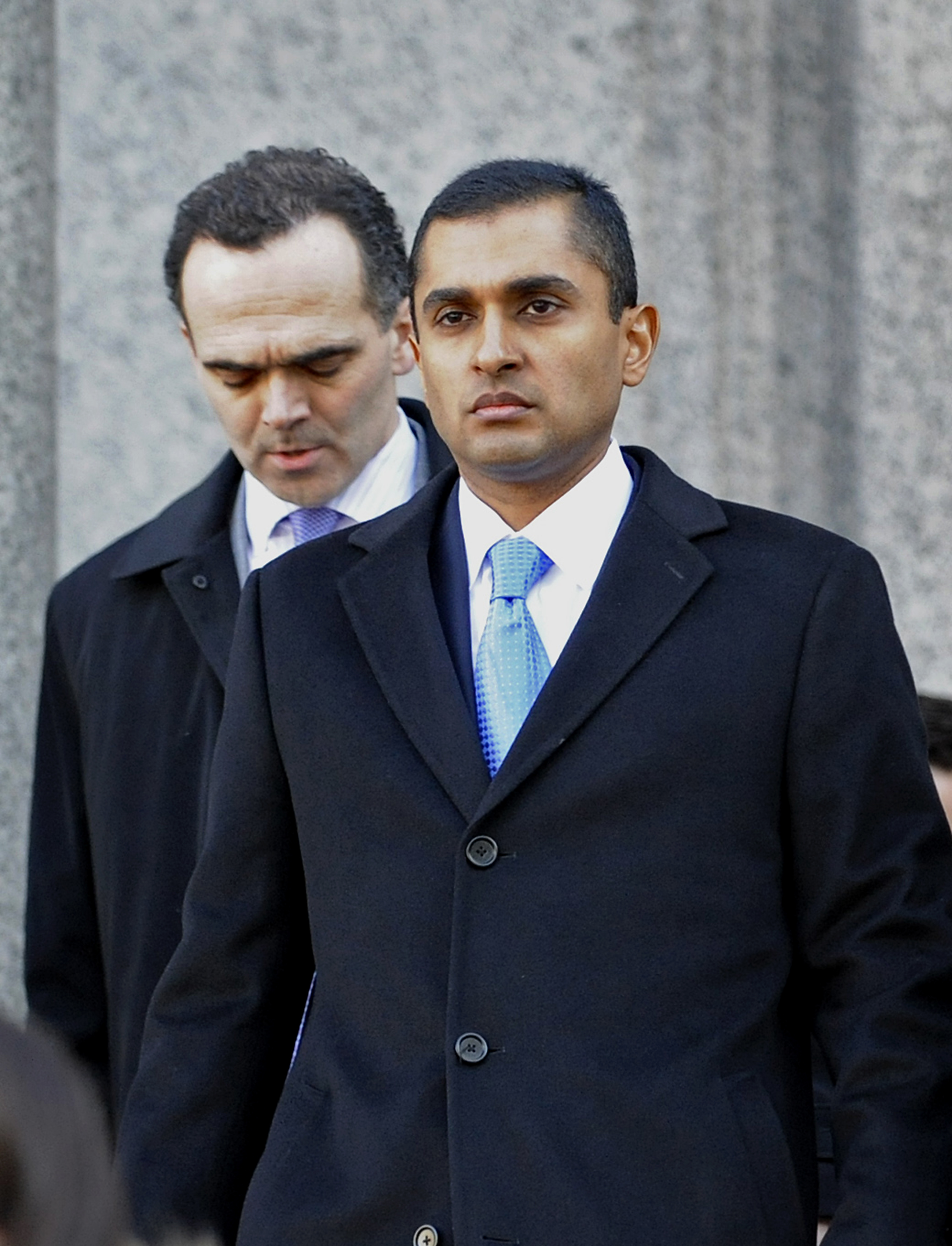 Mathew Martoma, center, a former portfolio manager with SAC Capital Advisors LP, exits federal court in New York, U.S. following the jury's verdict, on Thursday, Feb. 6, 2014. (Louis Lanzano / Bloomberg via Getty Images)