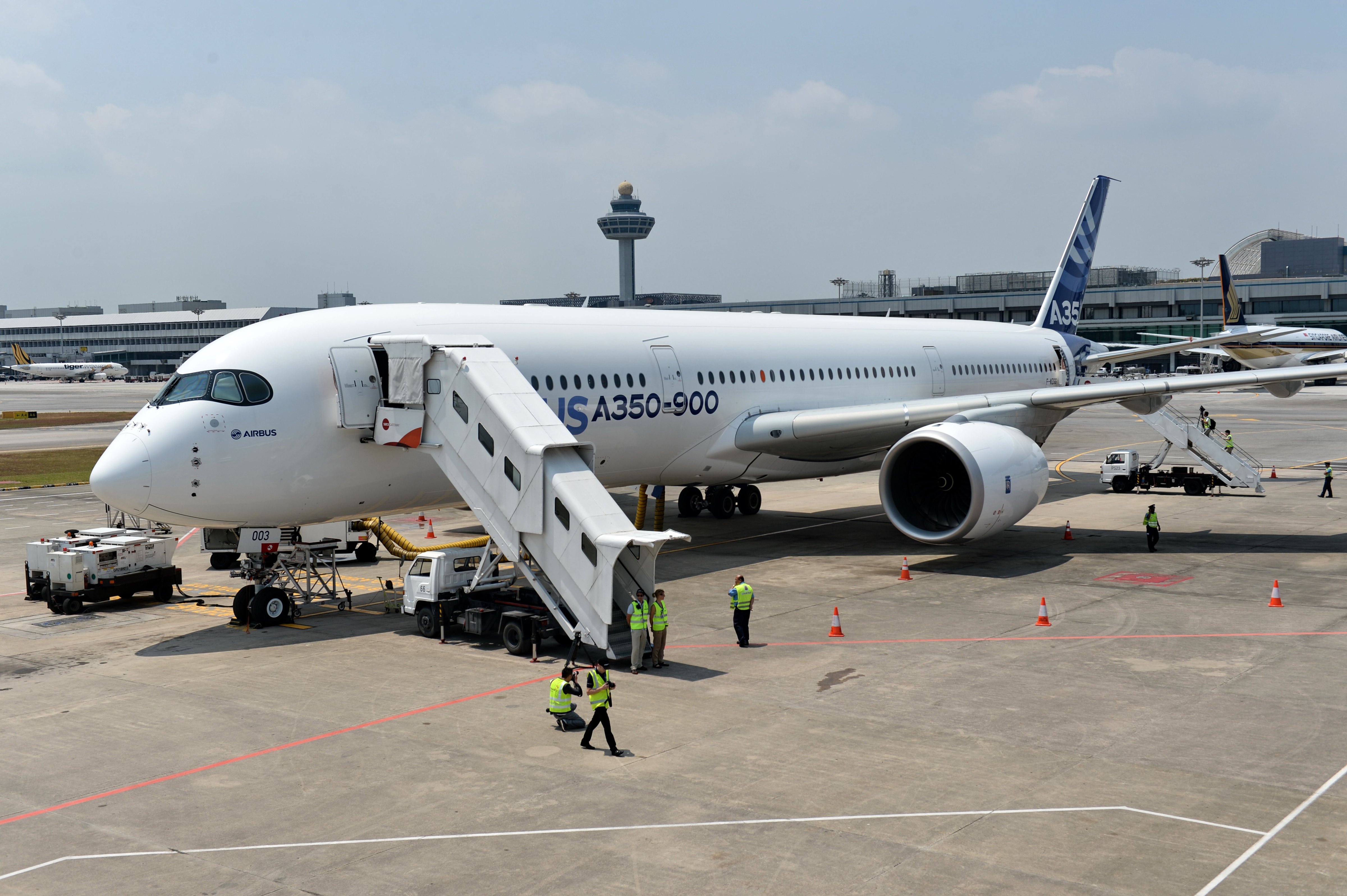 An Airbus A350-900 sits on the tarmac during a media preview at Changi Interational Airport ahead of the Singapore Airshow on Feb. 10, 2014. (Roslan Rahman / AFP / Getty Images)