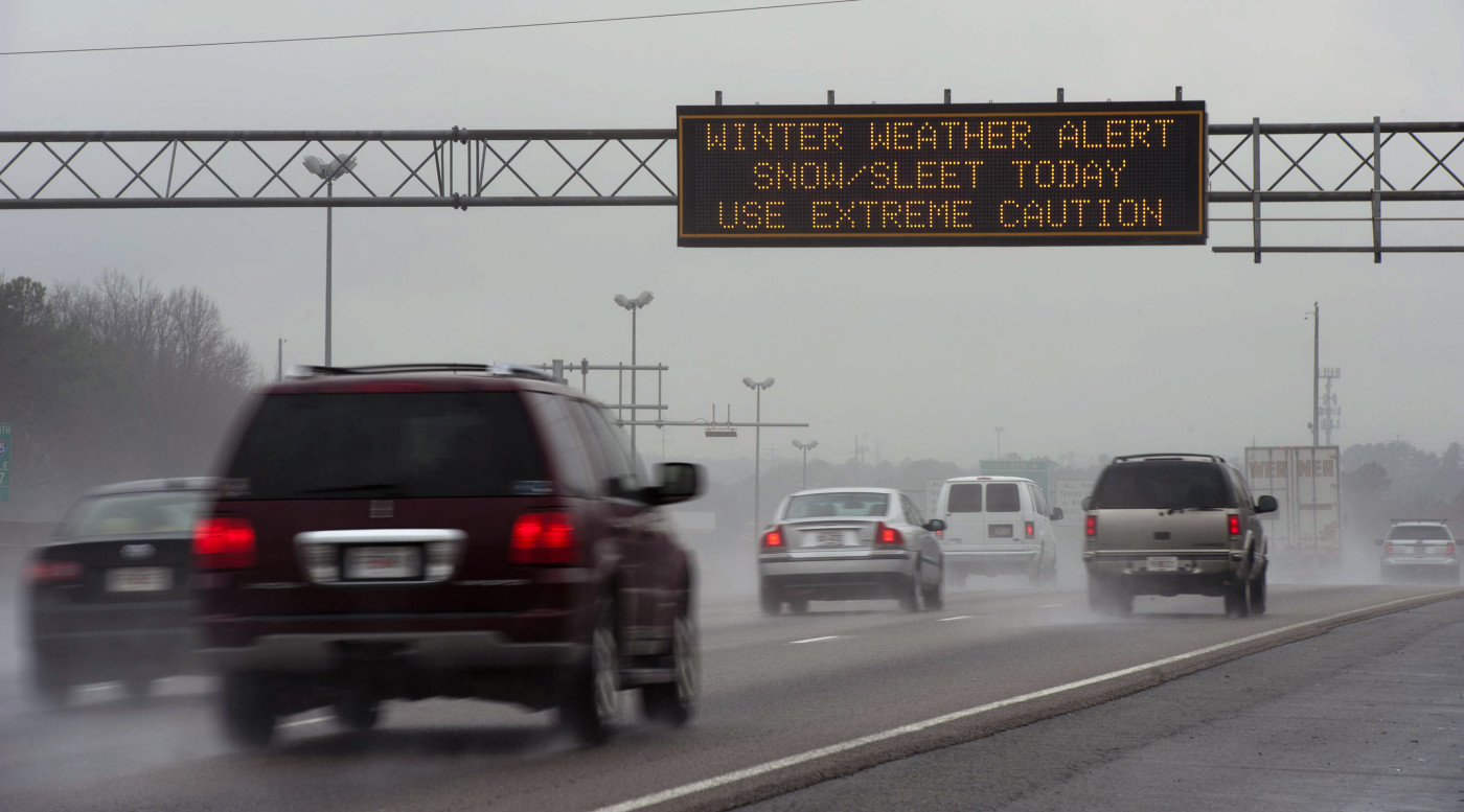 Travel advisory signs along I-85 South warn drivers of upcoming hazardous driving conditions on February 11, 2014 in Atlanta. (Davis Turner&mdash;Getty Images)