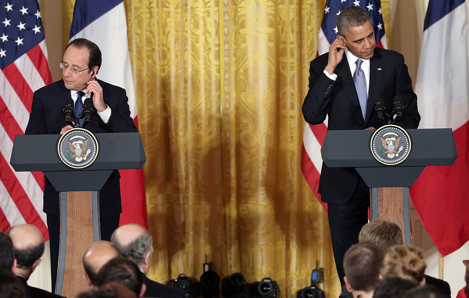 President Barack Obama and French President Francois Hollande arrive for a joint press conference in the East Room at the White House on Feb. 11, 2014 in Washington. (Chip Somodevilla—Getty Images)