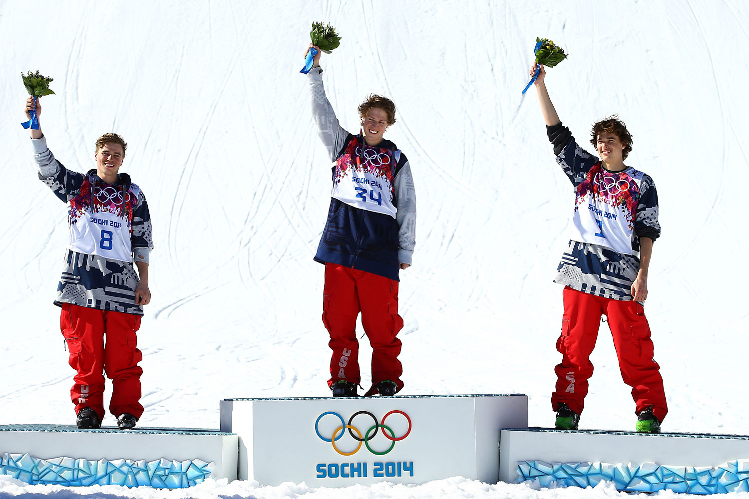 Silver medalist Gus Kenworthy of the United States, gold medalist Joss Christensen of the United States and bronze medalist Nicholas Goepper of the United States stand on the podium during the flower ceremony after the Freestyle Skiing Men's Ski Slopestyle Finals on Feb. 13, 2014 in Sochi. (Al Bello—Getty Images)