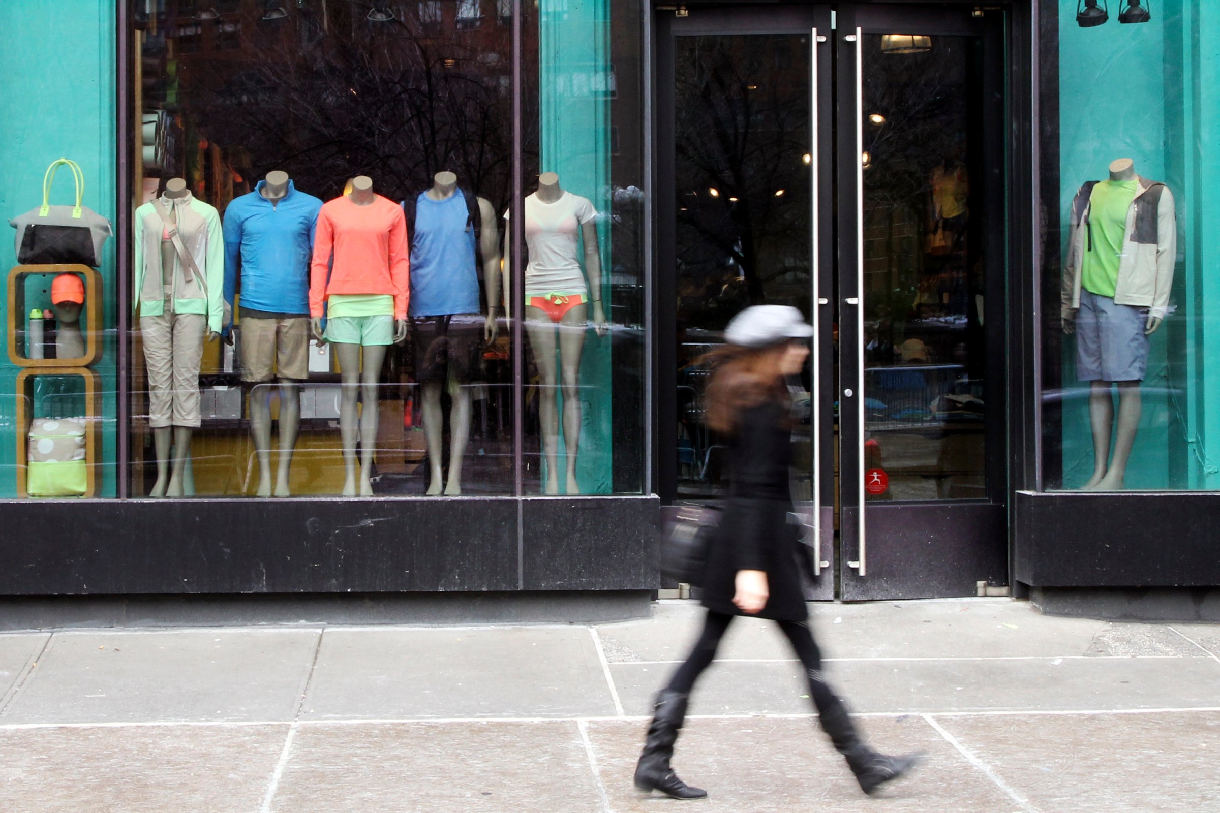 A pedestrian walks past the Lululemon Athletica store at Union Square in New York, March 19, 2013.