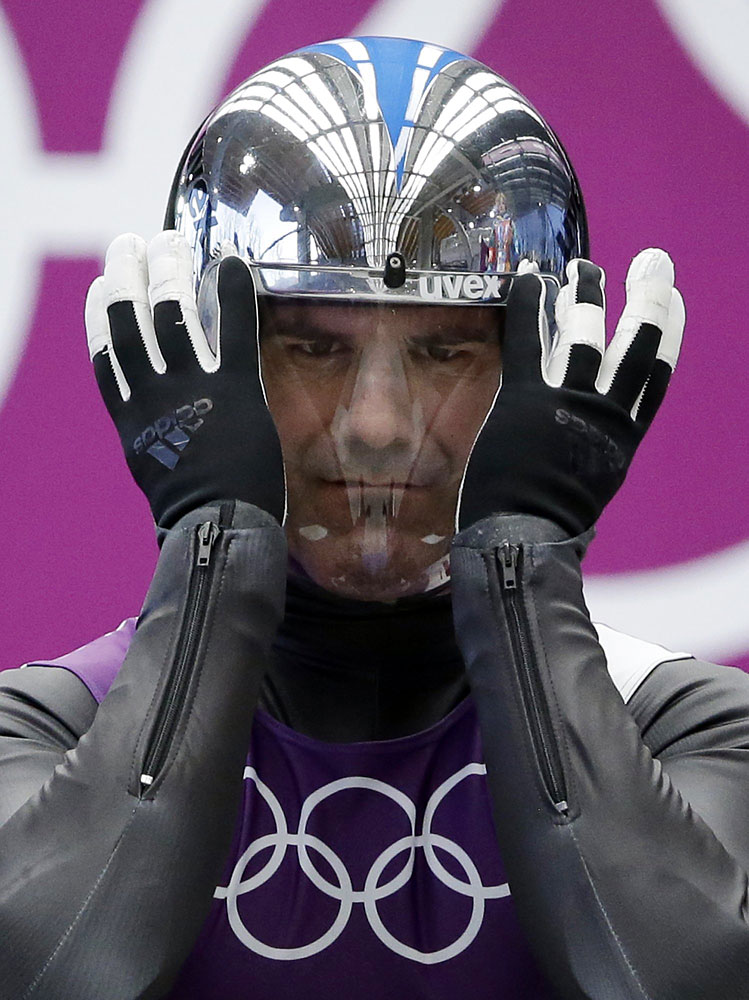 Armin Zoeggeler of Italy prepares to start his run during a training session for the men's singles luge at the 2014 Winter Olympics, Feb. 6, 2014, in Krasnaya Polyana, Russia.