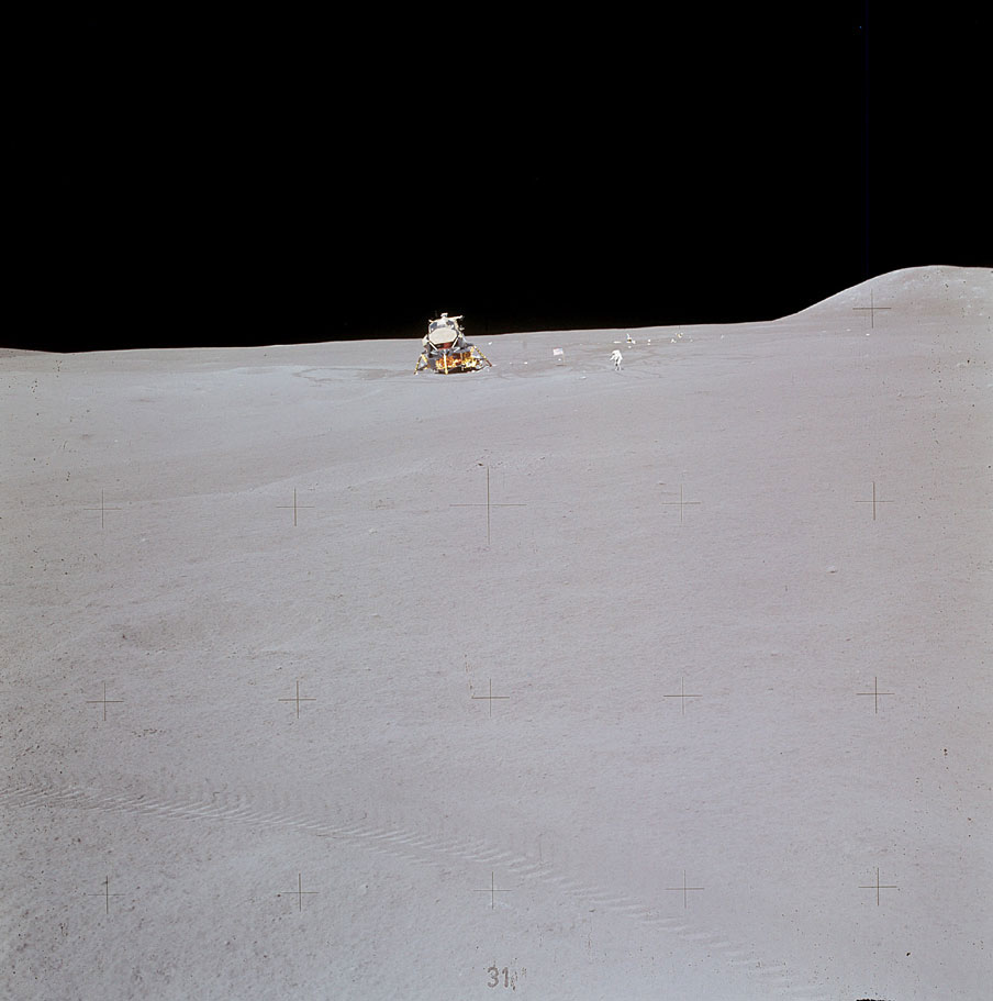 Jim Irwin with the lunar module and the ALSEP in the background. The distance the crew traveled from the EM home was considerable—and would have been forbidding if the rover had stalled.