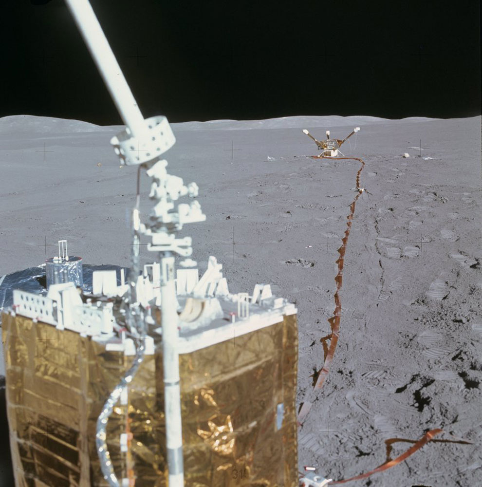 A single frame from a panning shot captures the central station, the lunar seismometer off to its left and the magnetometer in the background.