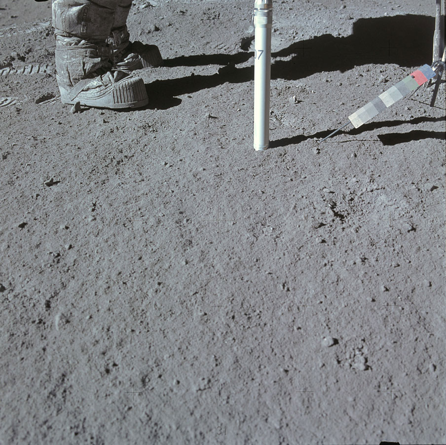 One of the most labor-intensive jobs lunar astronauts had was pushing—sometimes hammering—hollow rods in the ground to collect core samples of the moon's subsurface. Here, Scott photographs Irwin inserting core number seven.