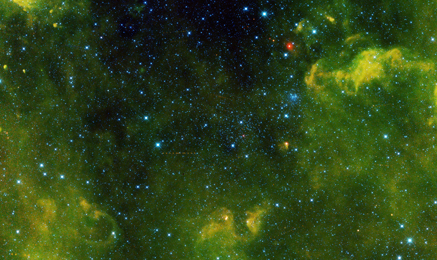 More than 100 asteroids were captured in this view from NASA's Wide-field Infrared Survey Explorer, or WISE, released on Jan. 23, 2014, during its primary all-sky survey. The asteroid at center left is called (2415) Ganesa. Clusters of stars can also be seen.