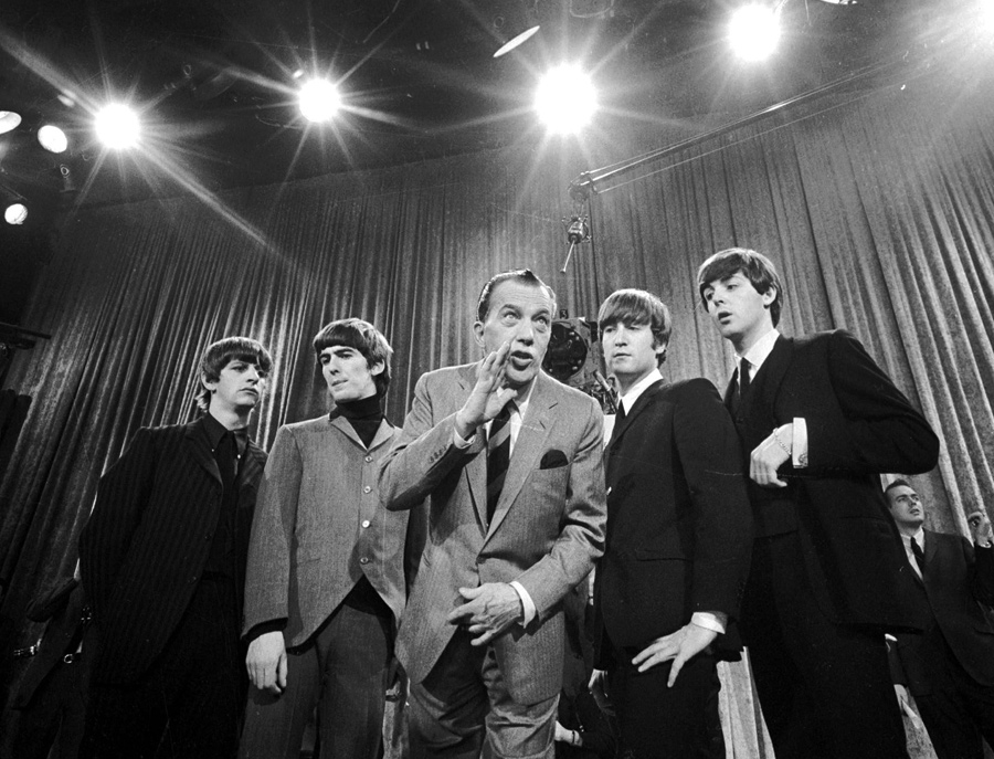 Ed Sullivan, center, stands with The Beatles during a rehearsal for the British group's first American appearance, on the "Ed Sullivan Show," in New York on Feb. 9, 1964. (AP)