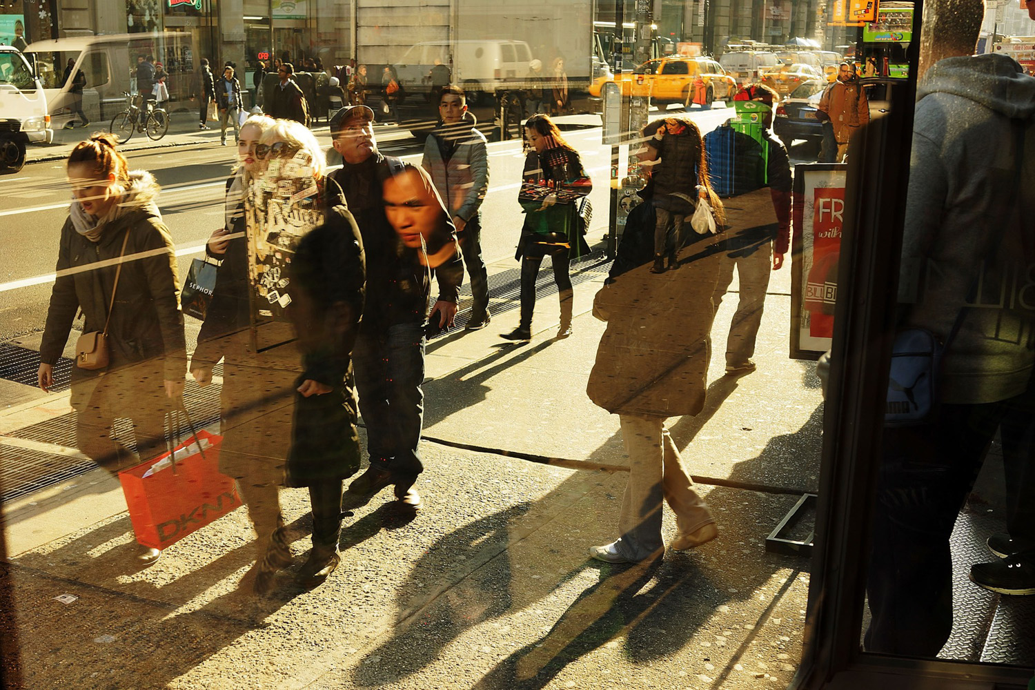 People walk along Broadway on December 2, 2013 in New York City. (Spencer Platt—Getty Images)