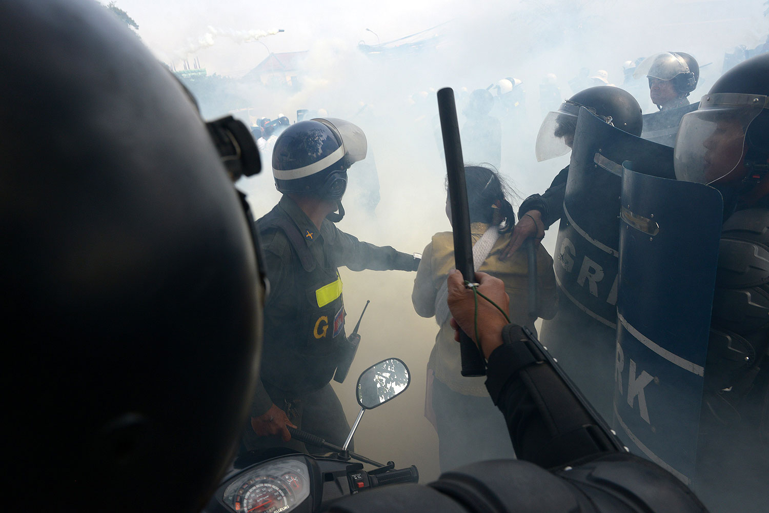 Cambodian military police clash with protesters during a protest in Phnom Penh on Jan. 27, 2014 (Tang Chhin Sothy / AFP / Getty Images)