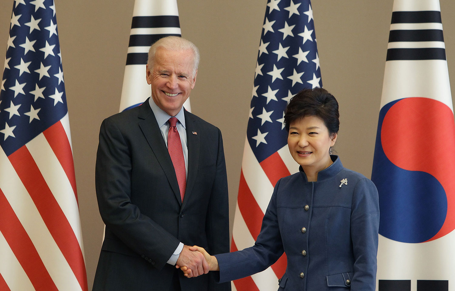 U.S. Vice President Joe Biden shakes hands with South Korean President Park Geun-Hye, right, during their meeting at presidentisl house on Dec. 6, 2013 in Seoul, South Korea to discuss, among other things, the Trans-Pacific Partnership. (Chung Sung-Jun&mdash;Getty Images)