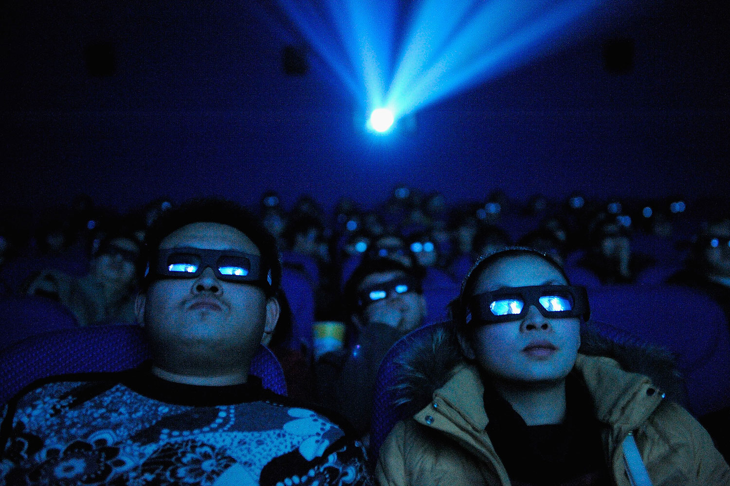 A Chinese cinema audience watches a movie through 3D glasses (ChinaFotoPress—Getty Images)